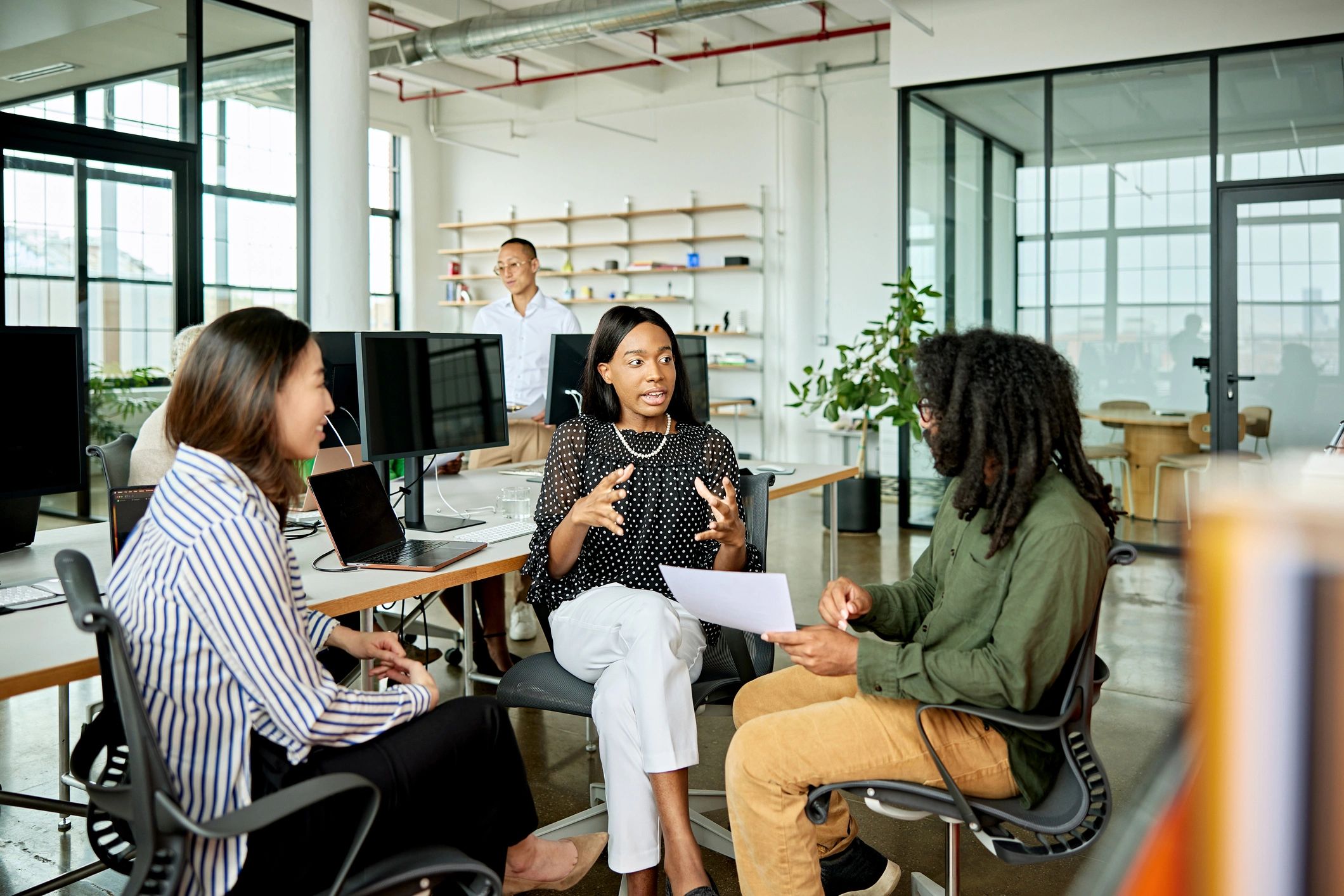 Consulting professionals exchanging ideas in an office