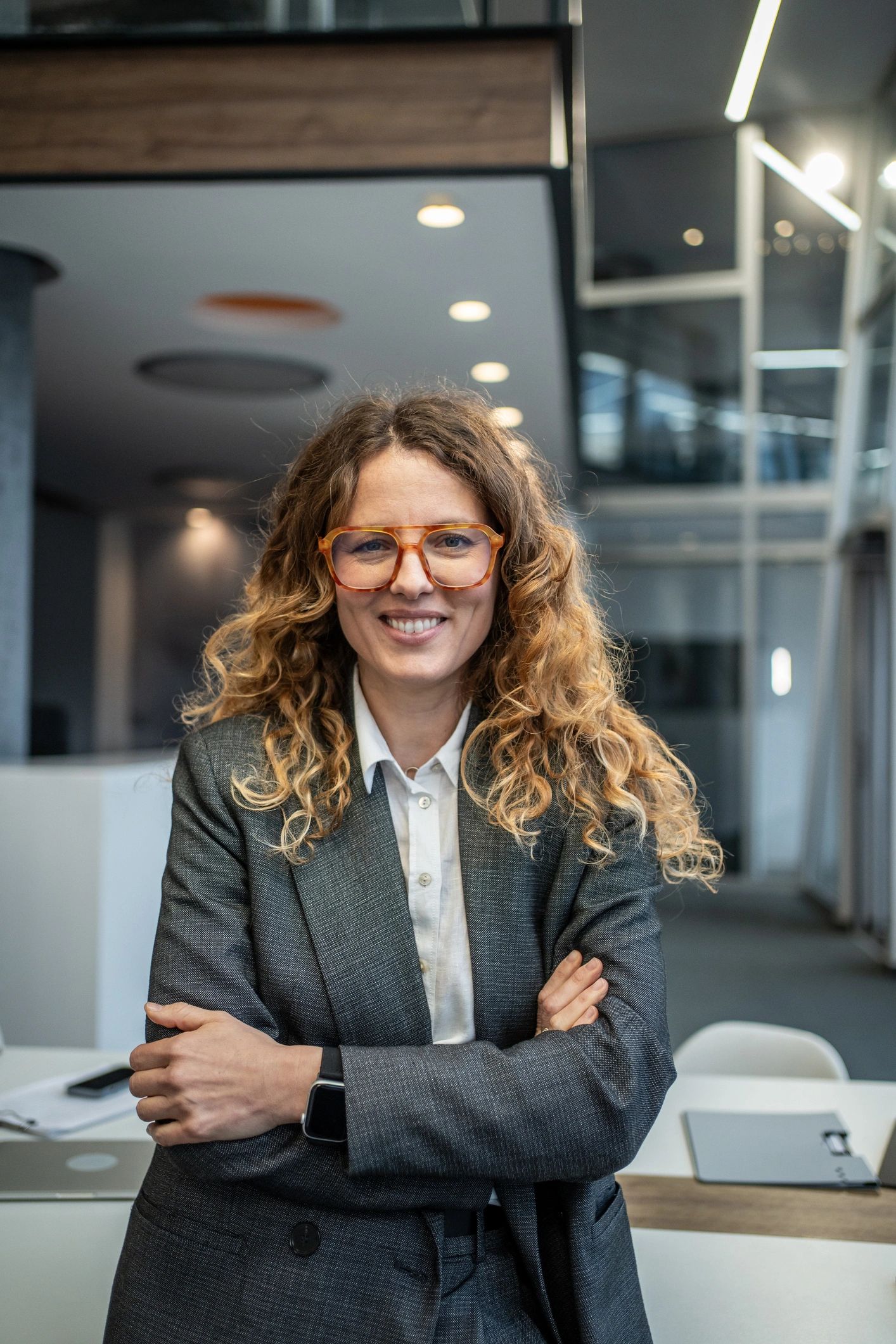 Professional headshot of a confident businesswoman in an office