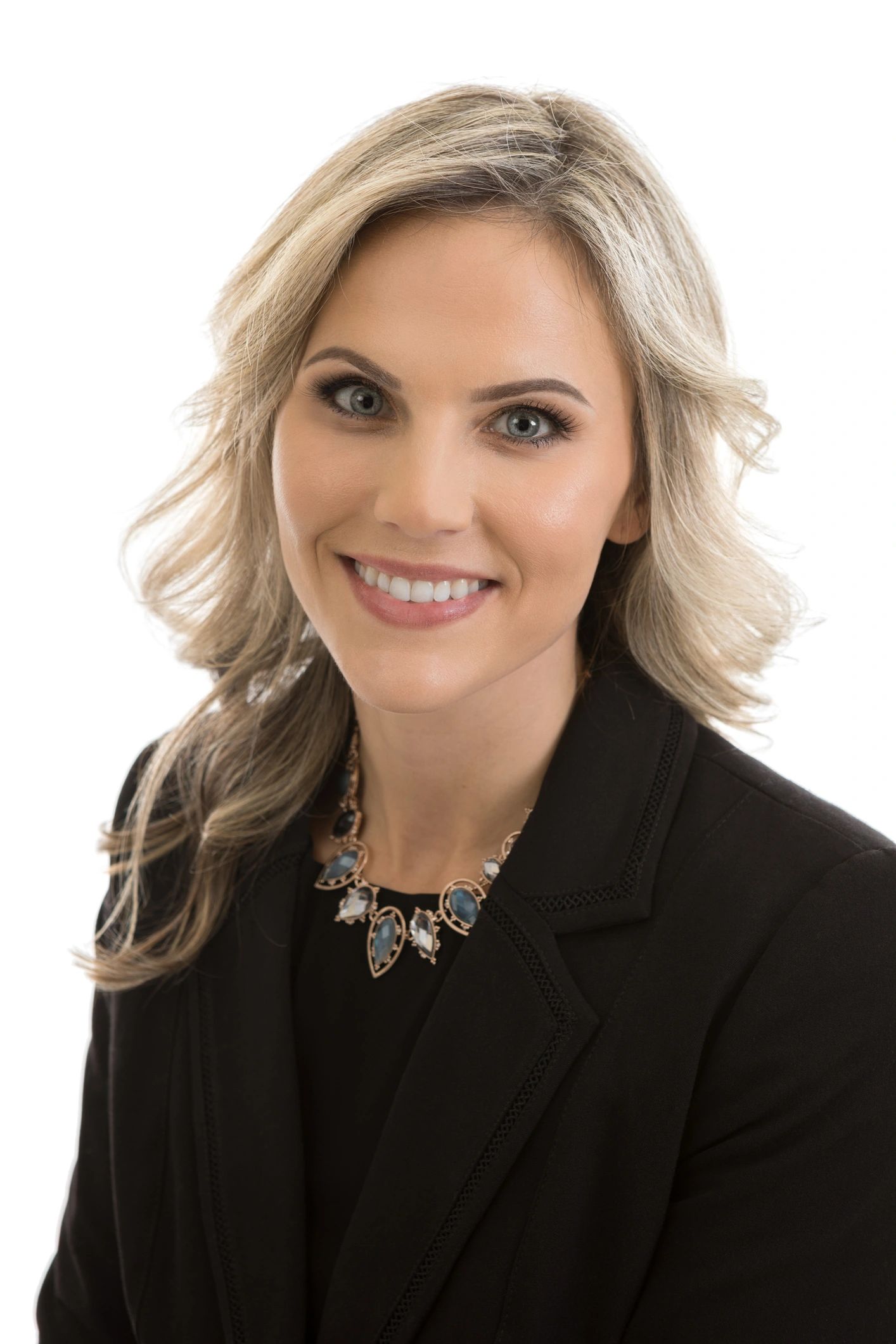 Professional headshot of a businesswoman in formal attire